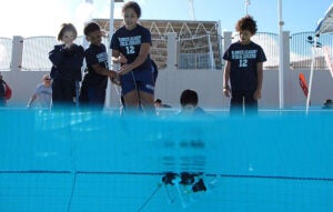 Students operate an underwater robot during the annual BIOS ROV competition