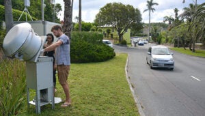 scientists check the air quality monitoring station on East Broadway in Hamilton, Bermuda